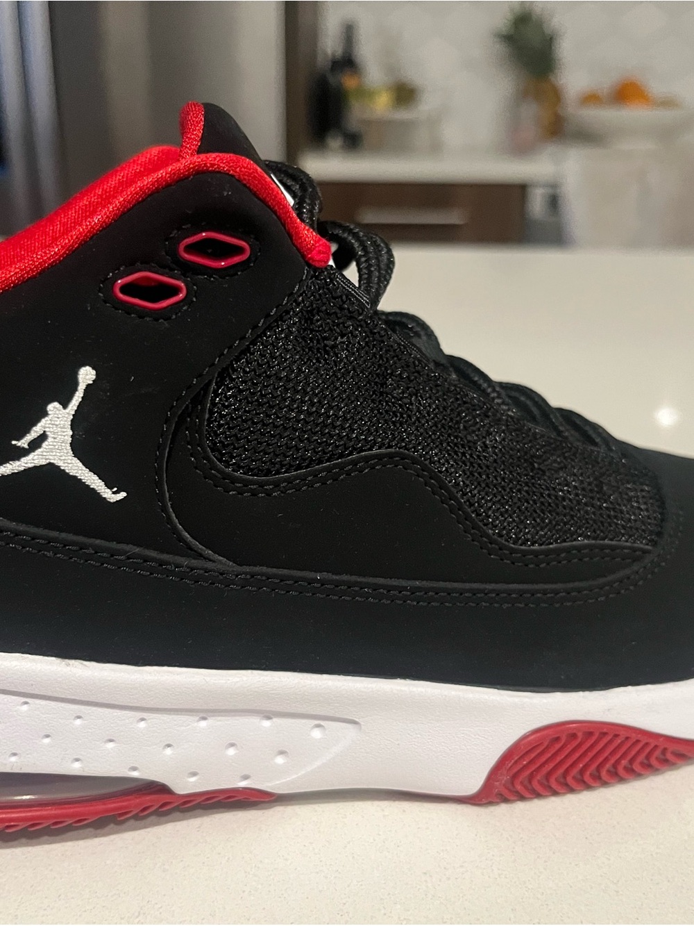 Jordan Black and Red Mid/High Top Basketball Sneaker with White Jumpman